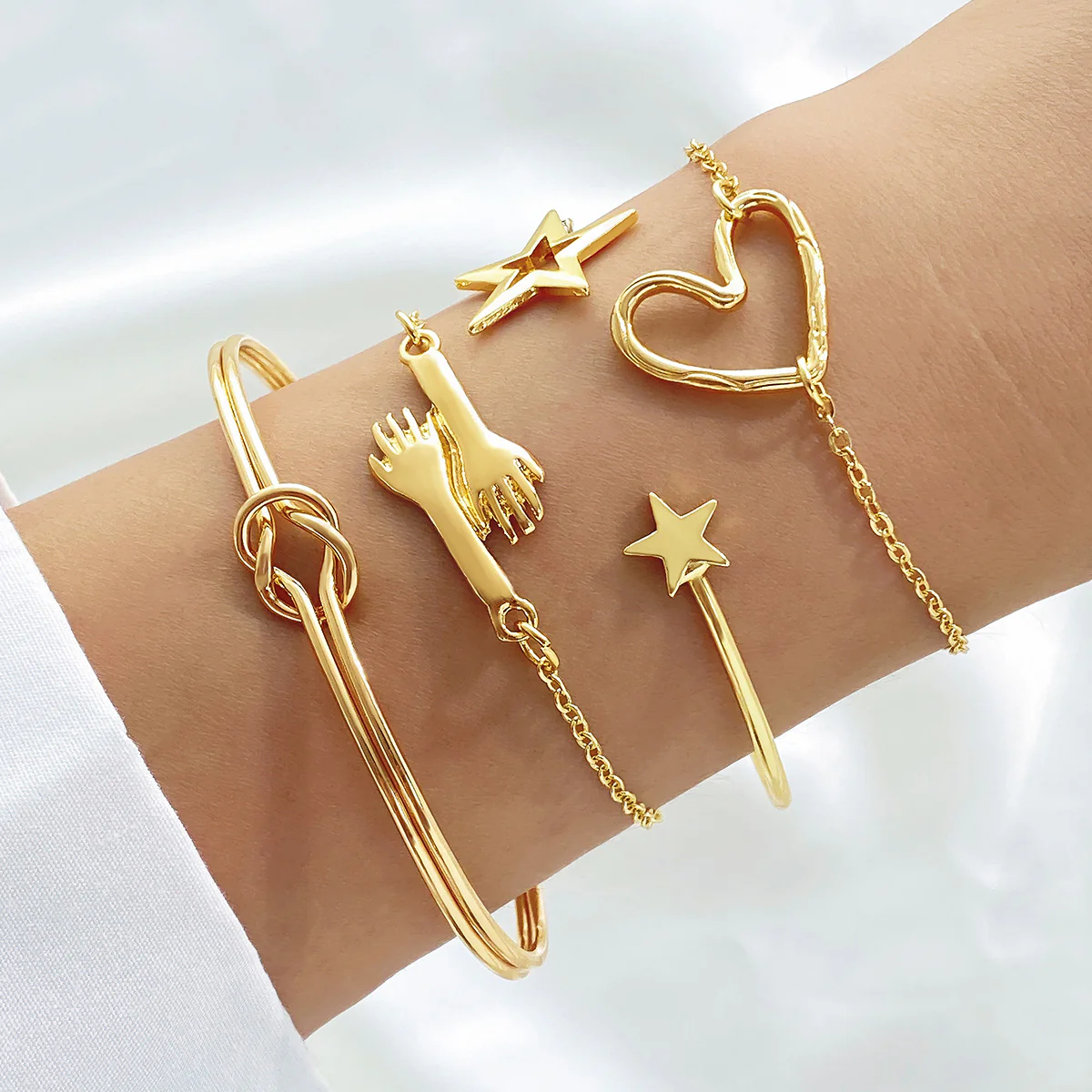 4-Piece Creative Heart Crossed Alloy Bangle Bracelet Set - Image 10